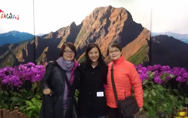 3 women in front of mountain