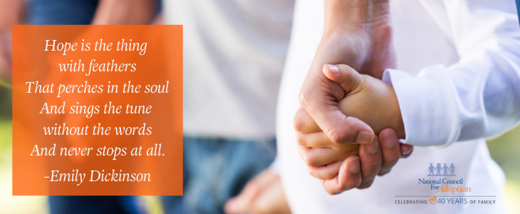 An adult hand holding a child's hand, quote