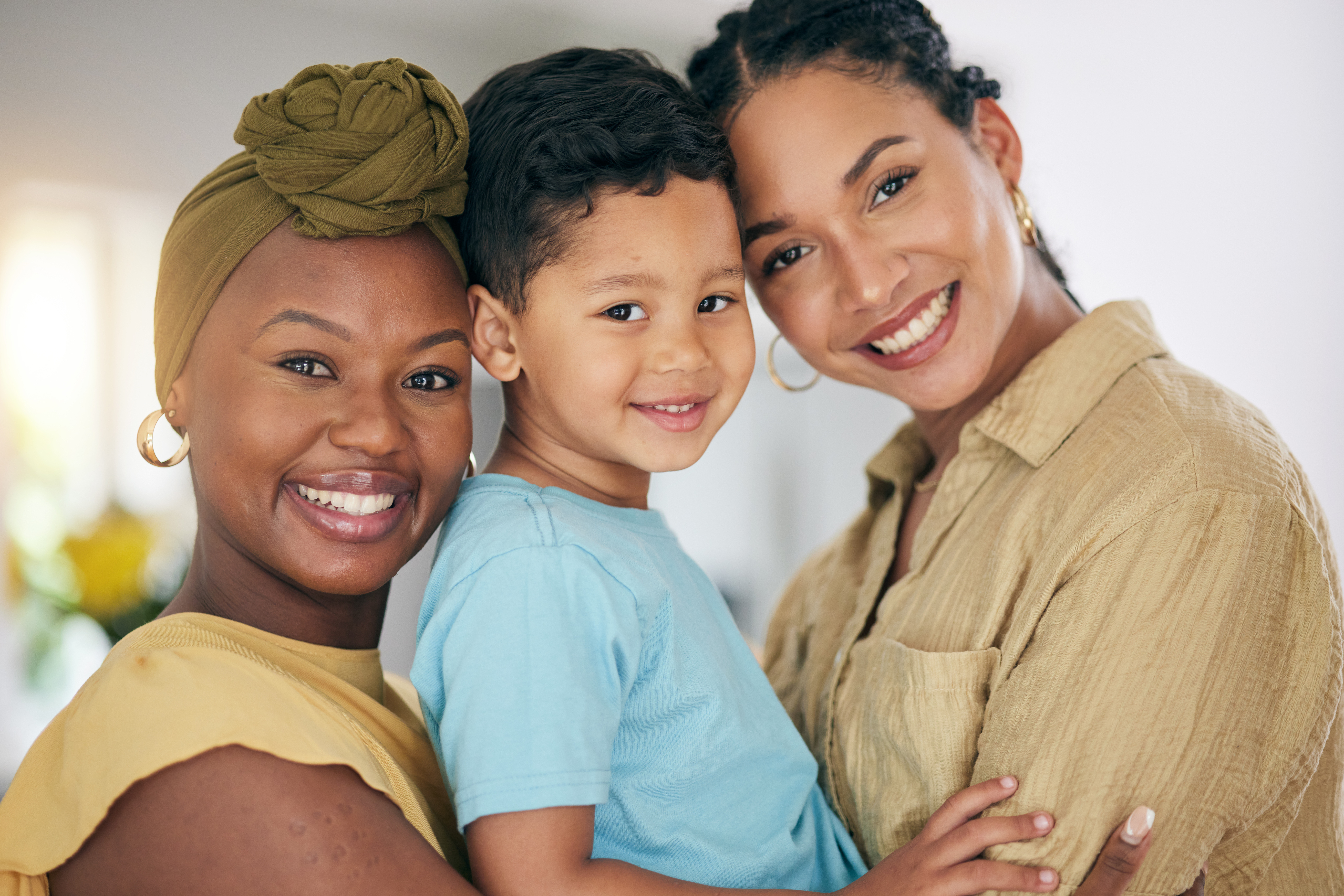 LGBT, child or happy portrait of family, non binary partner or transgender mom enjoy quality time together. Love bond, home or face of gay people, homosexual mothers or lesbian women hug adoption kid LGBT, child or happy portrait of family, non binary partner or transgender mom enjoy quality time together. Love bond, home or face of gay people, homosexual mothers or lesbian women hug adoption kid.